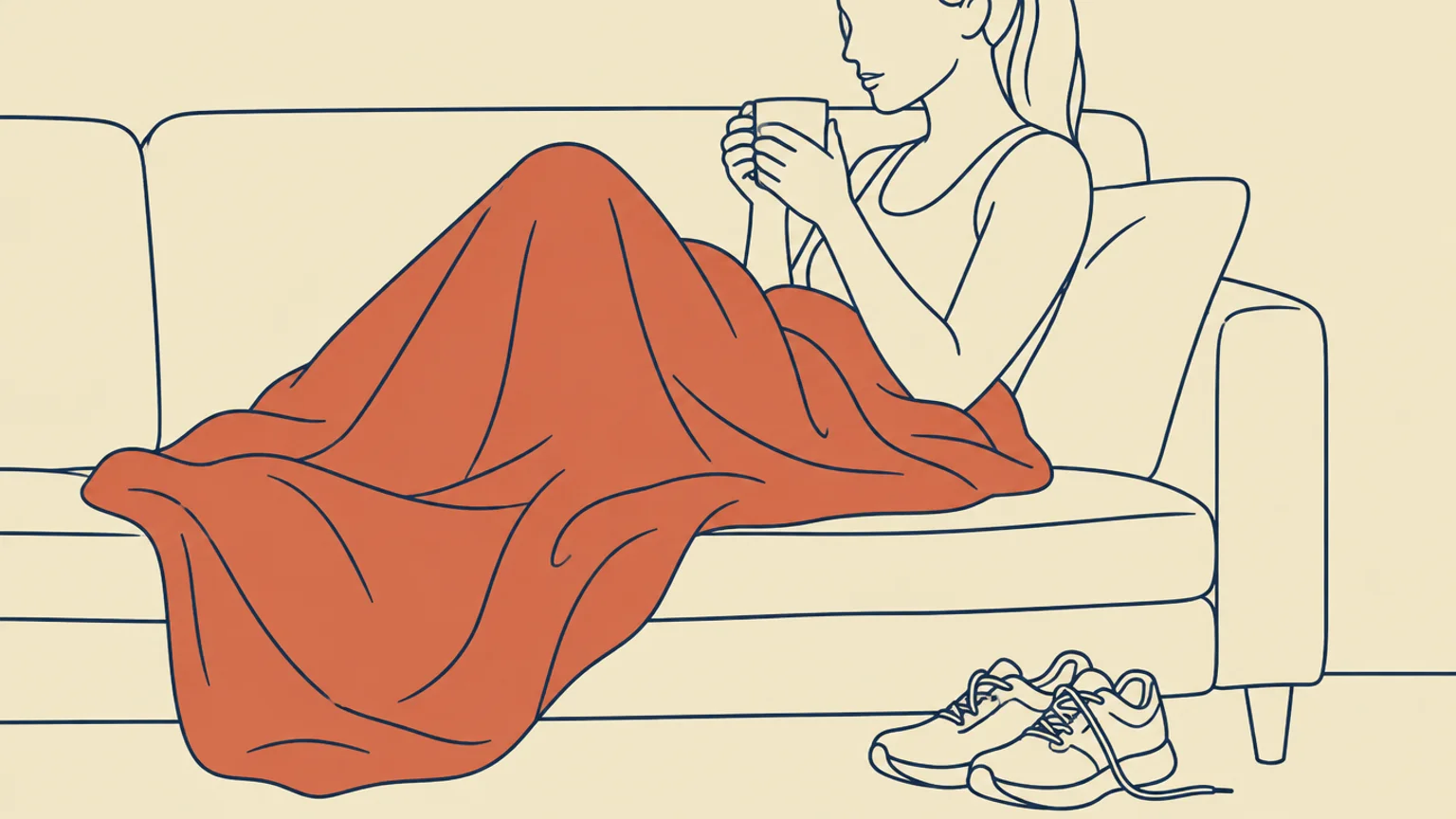 Kvinne hviler på sofaen med pledd og te, joggesko på gulvet